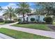 Luxury home with palm trees and brick walkway at 15908 Castle Park Ter, Lakewood Ranch, FL 34202