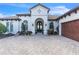 Luxury home with arched entryway and two-car garage at 15908 Castle Park Ter, Lakewood Ranch, FL 34202