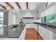 Spacious kitchen with large island, granite countertops, and white cabinets at 15908 Castle Park Ter, Lakewood Ranch, FL 34202