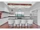 Modern kitchen with white cabinets, granite countertops, and stainless steel appliances at 15908 Castle Park Ter, Lakewood Ranch, FL 34202