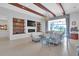 Bright living room with built-ins and access to lanai at 15908 Castle Park Ter, Lakewood Ranch, FL 34202