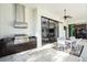 Modern outdoor kitchen with stainless steel appliances and dark wood cabinetry at 15908 Castle Park Ter, Lakewood Ranch, FL 34202