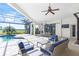 Spacious covered patio with seating area overlooking the pool and golf course at 15908 Castle Park Ter, Lakewood Ranch, FL 34202