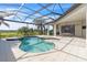 Luxury pool and spa with covered patio and outdoor dining at 15908 Castle Park Ter, Lakewood Ranch, FL 34202