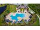 Resort-style pool with plenty of lounge chairs and umbrellas at 15908 Castle Park Ter, Lakewood Ranch, FL 34202