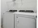 Bright laundry room with washer and dryer at 4237 Big Sky Dr, Spring Hill, FL 34604