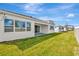 Home exterior showcasing backyard with grassy lawn at 8328 Golden Beach Ct, Parrish, FL 34219