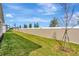 Landscaped backyard with grassy lawn and privacy wall at 8328 Golden Beach Ct, Parrish, FL 34219