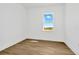 Bright bedroom with large window and light wood-look flooring at 8328 Golden Beach Ct, Parrish, FL 34219
