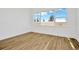 Bright bedroom with wood-look tile flooring and large windows at 8328 Golden Beach Ct, Parrish, FL 34219