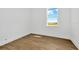 Spacious bedroom with large window and light wood-look flooring at 8328 Golden Beach Ct, Parrish, FL 34219