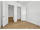 Bedroom with two closets and wood-look floors at 8328 Golden Beach Ct, Parrish, FL 34219
