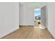 Bright entryway with open doors and light wood flooring at 8328 Golden Beach Ct, Parrish, FL 34219