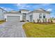 Two-story house with gray garage doors and a paved driveway at 8328 Golden Beach Ct, Parrish, FL 34219