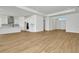 Modern kitchen with white cabinets and open to the living room at 8328 Golden Beach Ct, Parrish, FL 34219