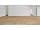 Spacious living area with wood-look floors and an open floor plan at 8328 Golden Beach Ct, Parrish, FL 34219