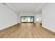 Bright and airy living room with wood-look floors and access to backyard at 8328 Golden Beach Ct, Parrish, FL 34219
