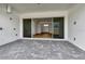 Covered patio with pavers and sliding glass doors leading to the interior at 8328 Golden Beach Ct, Parrish, FL 34219