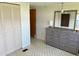 Spacious bedroom with double doors and dresser at 39047 Ola Ave, Zephyrhills, FL 33542
