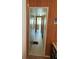 Long hallway with wood paneling and tiled floor at 39047 Ola Ave, Zephyrhills, FL 33542
