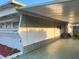 Side view of the mobile home showing additional parking at 39047 Ola Ave, Zephyrhills, FL 33542