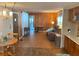 Open living area with wood-paneled walls at 39047 Ola Ave, Zephyrhills, FL 33542