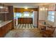 Cozy kitchen with wood cabinets and tile floor at 39047 Ola Ave, Zephyrhills, FL 33542