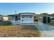 Single-wide mobile home with carport at 39047 Ola Ave, Zephyrhills, FL 33542