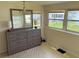 Bedroom with dresser and large mirror, offering ample space at 39047 Ola Ave, Zephyrhills, FL 33542