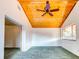 Spacious bedroom with wood ceiling and carpet flooring at 1810 Haverford Ave, Sun City Center, FL 33573