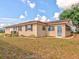 Single-story house with a landscaped yard at 1810 Haverford Ave, Sun City Center, FL 33573