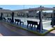 Shuffleboard courts with covered seating areas at 1810 Haverford Ave, Sun City Center, FL 33573