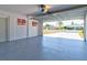 Garage with epoxy floor and open to backyard at 1810 Haverford Ave, Sun City Center, FL 33573