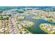 An aerial view of a waterfront community with lush green spaces at 1810 Haverford Ave, Sun City Center, FL 33573