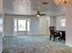 Spacious living room with carpeted floor and bay window at 1810 Haverford Ave, Sun City Center, FL 33573