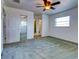 Carpeted bedroom with mirrored closet doors at 1810 Haverford Ave, Sun City Center, FL 33573