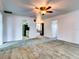 Open living room with view into dining area and kitchen at 1810 Haverford Ave, Sun City Center, FL 33573