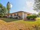 Well-maintained ranch house with landscaped yard and a spacious driveway at 1810 Haverford Ave, Sun City Center, FL 33573