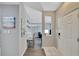 Bright condo entryway with hardwood floors and adjacent sitting area at 1228 S. Missouri Ave # 607, Clearwater, FL 33756