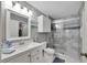Updated bathroom with white vanity and large walk-in shower at 1228 S. Missouri Ave # 607, Clearwater, FL 33756