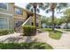 Condo building with staircase and tropical landscaping at 1228 S. Missouri Ave # 607, Clearwater, FL 33756