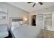 Cozy bedroom with gray upholstered bed and walk-in closet at 1228 S. Missouri Ave # 607, Clearwater, FL 33756