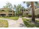 Two-story building with lush landscaping and walkways at 1228 S. Missouri Ave # 607, Clearwater, FL 33756