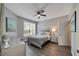 Second bedroom with a queen-size bed and large window at 1228 S. Missouri Ave # 607, Clearwater, FL 33756