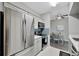 Modern kitchen with stainless steel appliances and view into dining area at 1228 S. Missouri Ave # 607, Clearwater, FL 33756