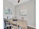 Bright dining area with light wood table and four chairs at 1228 S. Missouri Ave # 607, Clearwater, FL 33756