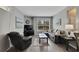Living room with gray sectional sofa, hardwood floors, and large window at 1228 S. Missouri Ave # 607, Clearwater, FL 33756