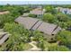 Aerial view of condo building showcasing landscaping and walkways at 1228 S. Missouri Ave # 607, Clearwater, FL 33756