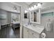 Clean bathroom with white vanity and view of bedroom at 1228 S. Missouri Ave # 607, Clearwater, FL 33756