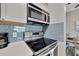 Modern kitchen with stainless steel appliances and stovetop at 1228 S. Missouri Ave # 607, Clearwater, FL 33756